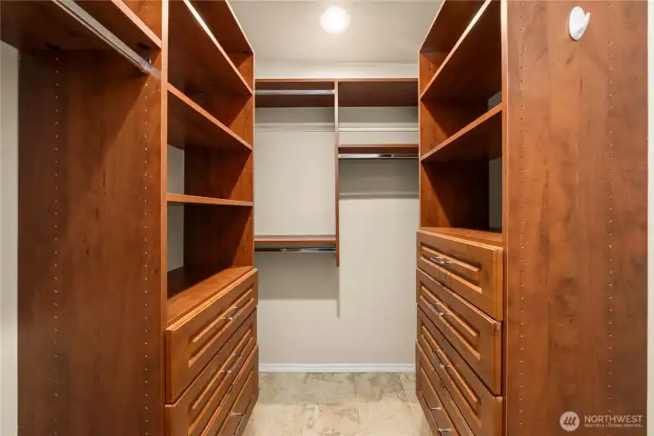 Another view of the primary walk-in closet.