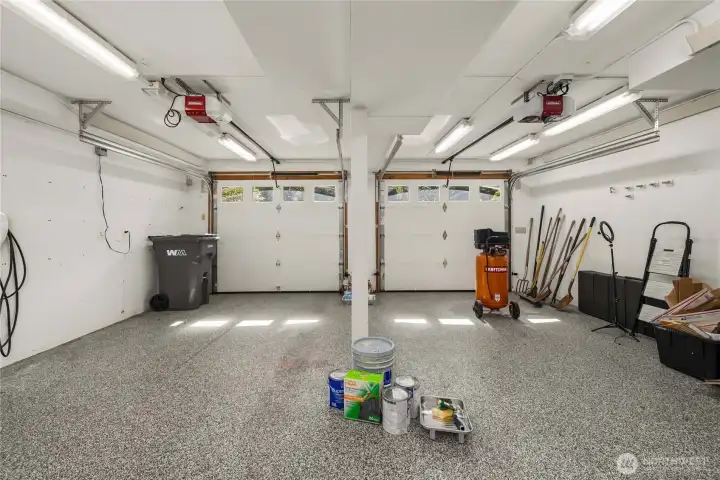 A two car garage that lives like a year-round dream workshop—heated and insulated with an epoxy floor and dual 220-amp circuits. EV-ready with an installed Tesla charger. A two car garage that lives like a year-round dream workshop—heated and insulated with an epoxy floor and dual 220-amp circuits. EV-ready with an installed Tesla charger.