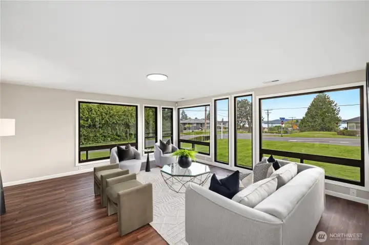 Large Front Windows Showcasing Views of the Sound and Olympics