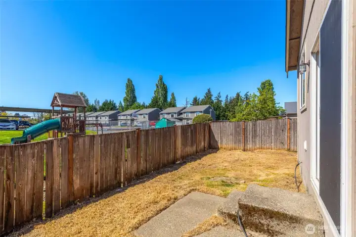 Low-maintenance fenced backyard