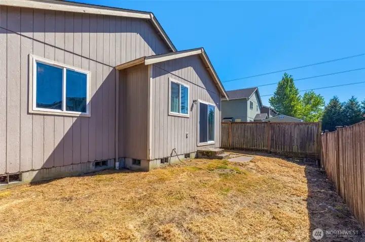 Low-maintenance fenced backyard