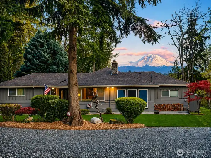 Luxury Maple Valley rambler on 3 private acres with stunning Mt. Rainier views, mature landscaping, and peaceful Pacific Northwest setting in the desirable Tahoma School District.