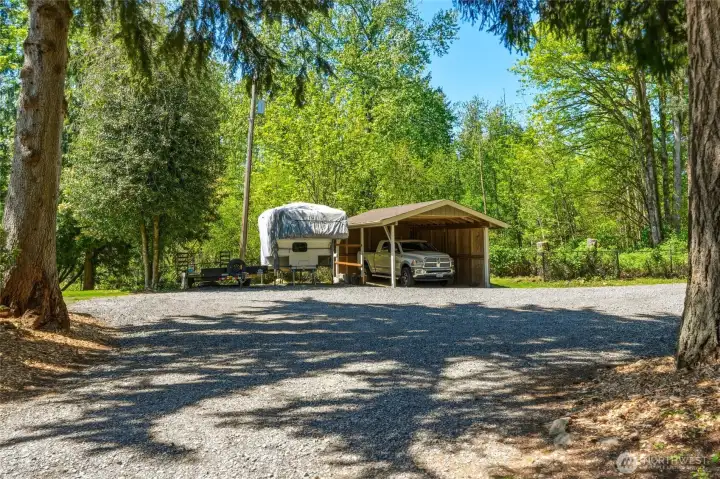 Detached garage and outbuildings offering flexible storage, workshop space, and potential hobby use on this spacious Maple Valley property.