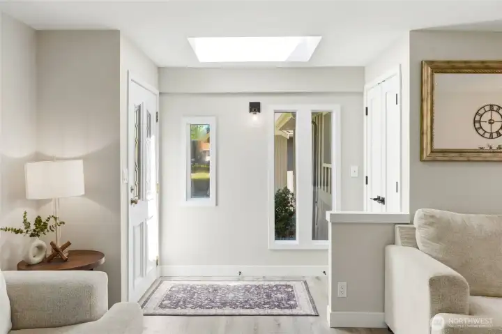 Light-filled entryway with clean lines, neutral tones, and seamless transition into main living spaces.
