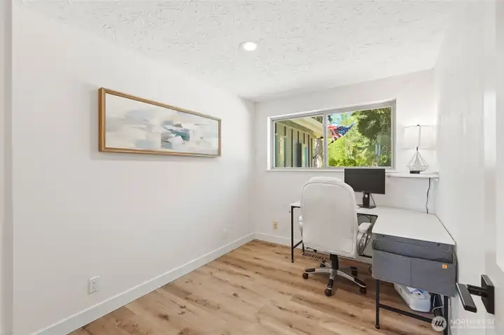 Flexible bonus room or home office with natural light, ideal for remote work or additional living space.