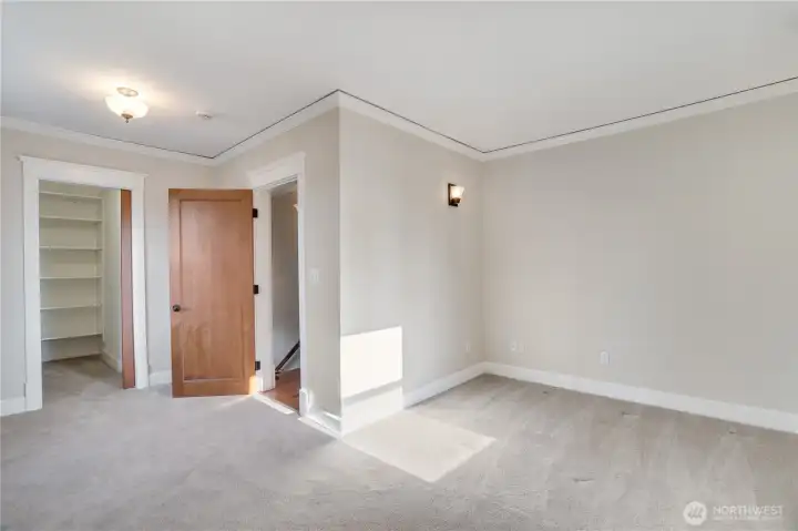 Generous rooms, walk-in closet, crown molding — and this is the secondary bedroom.