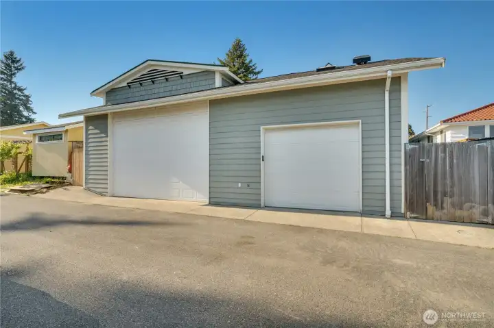46 × 26 feet. Paved alley access. Two doors. A 400 SF finished loft above. This is why you’re here.
