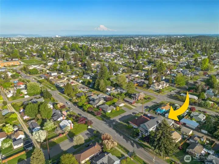 Ideally situated in a lush, tree-lined Tacoma neighborhood with iconic Mount Rainier views on the horizon — a true Pacific Northwest address.
