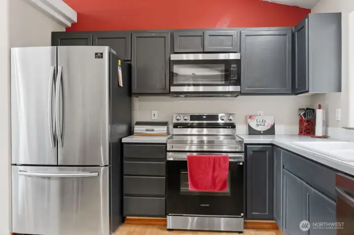 Convenient cabinets and countertops and stainless steel appliances in this kitchen provide a Joy of Cooking experience in this home.