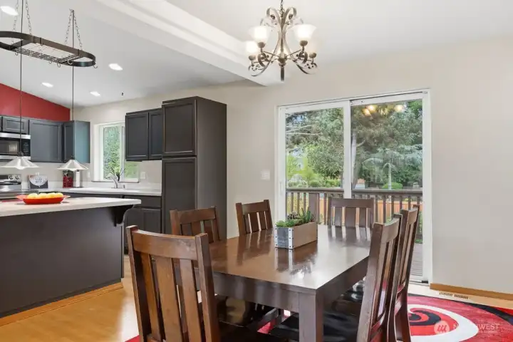 The dining room is right beside the kitchen for convenience and dining comfort. Just outside the patio doors is the backyard deck.