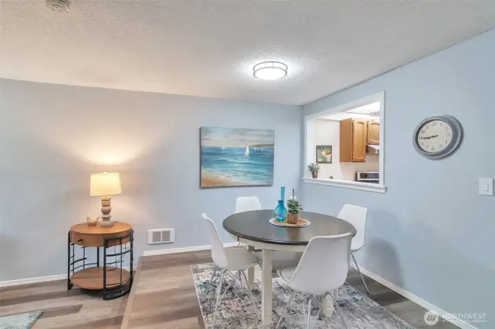 Dining room with view of pass through window to kitchen