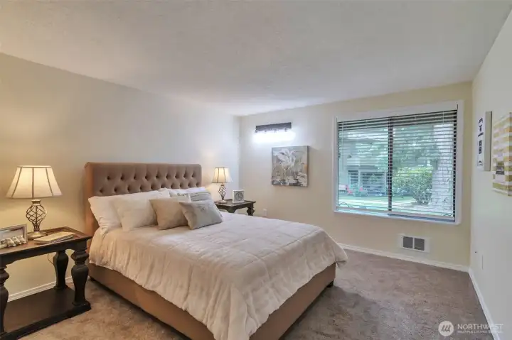 Master bedroom with view of outside.