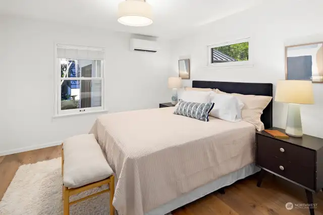 The second home's second bedroom features hardwood floors and ductless mini-splits for heat and A/C.