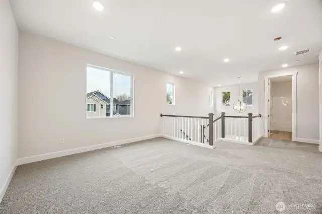 Open loft looking over two story entry