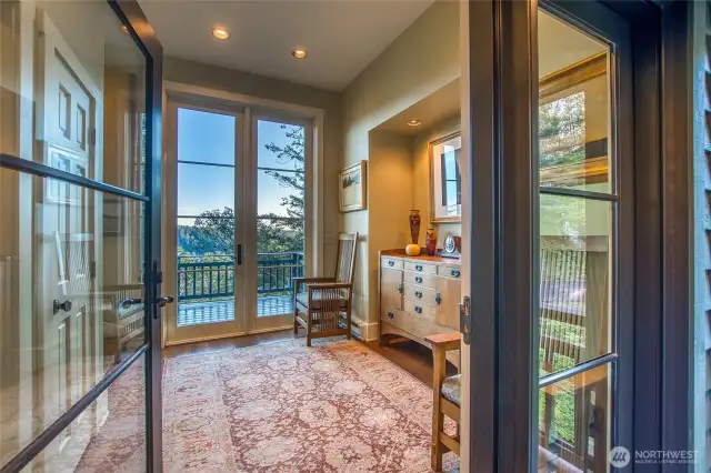 Generously-sized welcoming entry with view out the back. The stairs off the lower level mudroom lead right to this entry so you'll enjoy this ambiance every time you enter the house.