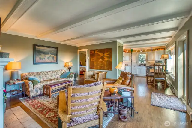 Open plan cozy living area. The main floor bedroom is through the doorway.