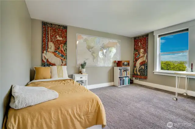 Considerations for the second upstairs bedroom: It features two bright windows, a closet, and scenic views as well.