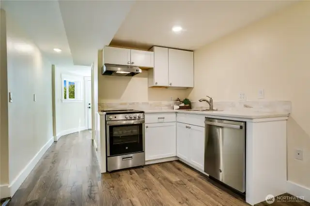 The addition of this kitchen enhances this rental opportunity, mother-in-law space or guest suite. Featuring stainless steel appliances, quartz countertops, and ample storage, this well-appointed kitchen is truly exceptional.
