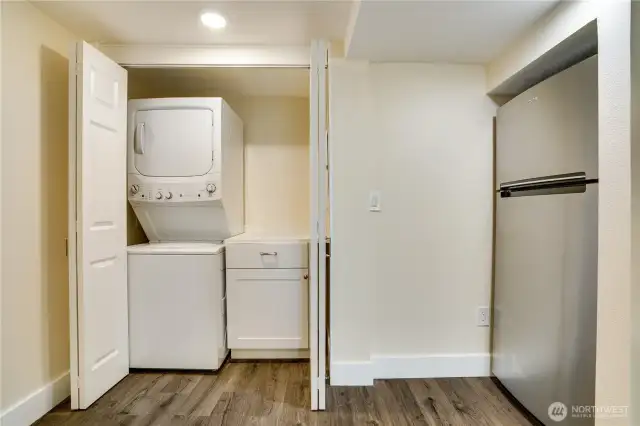 A full-sized refrigerator, added storage, and a washer/dryer complete this kitchen area. There's even a place for a little table.