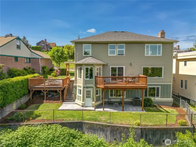This is the rear view of the home and property. The previous owner secured a lifetime or 75-year warranty for the stabilization of the foundation to provide reassurance.