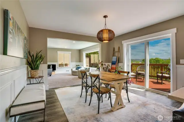 Another perspective of the dining room looking towards the living room. The wainscoting and chair rail provide continuity throughout the home.
