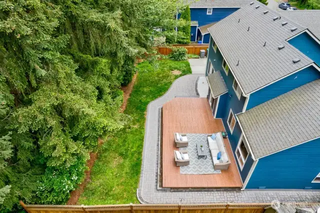 This home has so much privacy in the back yard. It features a large deck, new paver walkways with landscape lighting, and a large concrete patio on the side of the home.