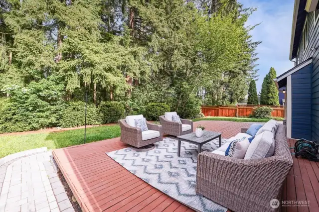 This home has so much privacy in the back yard. It features a large deck, new paver walkways with landscape lighting, and a large concrete patio on the side of the home.