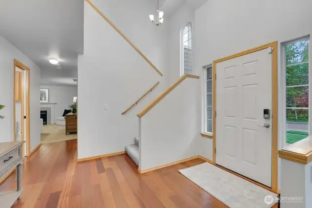 Vaulted ceilings in the entrance brings in natural light and a grand feel.