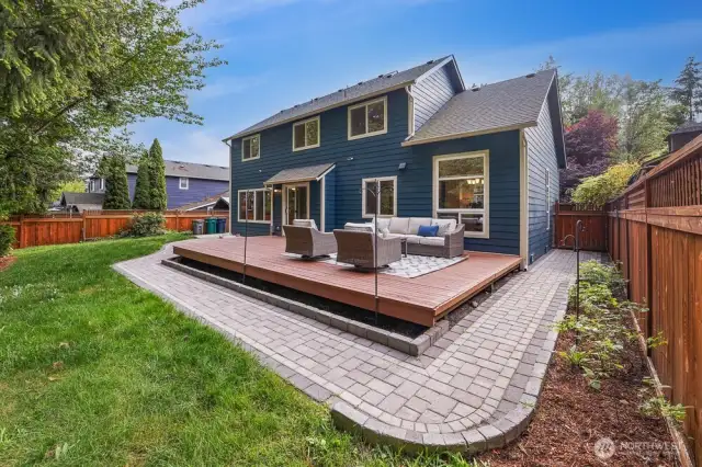 This home has so much privacy in the back yard. It features a large deck, new paver walkways with landscape lighting, and a large concrete patio on the side of the home.