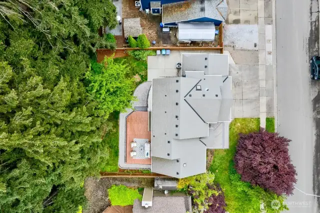 This home has so much privacy in the back yard. It features a large deck, new paver walkways with landscape lighting, and a large concrete patio on the side of the home.