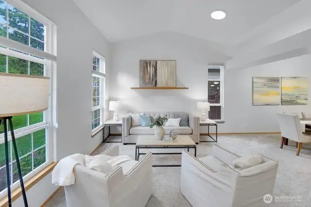 Large formal living room off the entrance with several windows.
