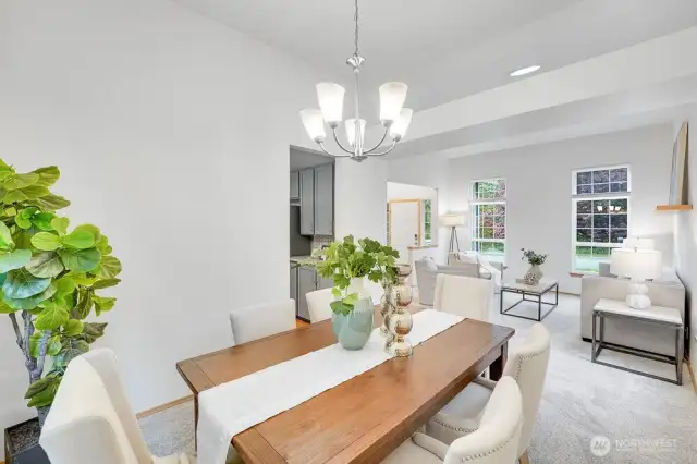 This photo shows the open floor plan between the dining and formal living.