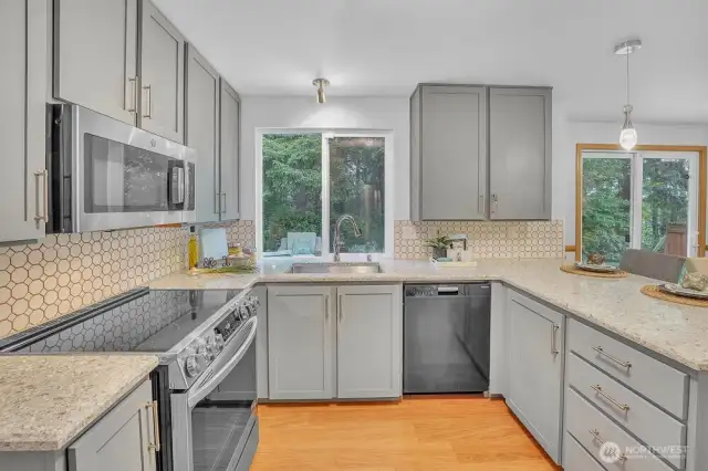 kitchen2Updated kitchen on the main floor includes upgraded appliances, painted cabinets, and stone countertops.
