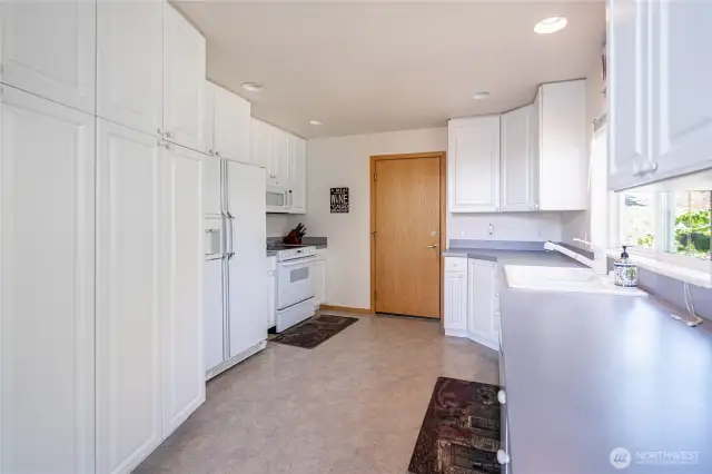 Entry to kitchen from garage and utility room