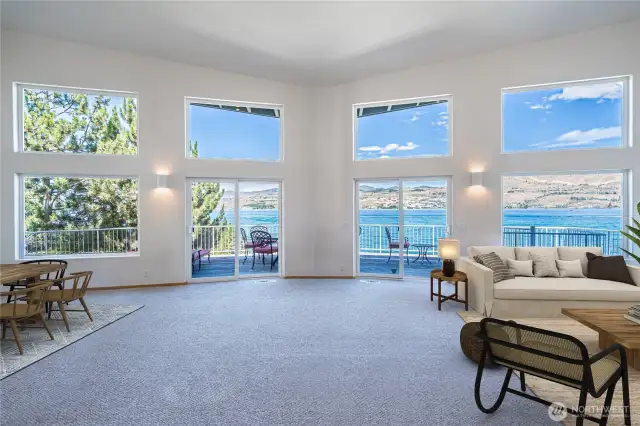 Double sliders open to deck over the waterfront  Virtually staged