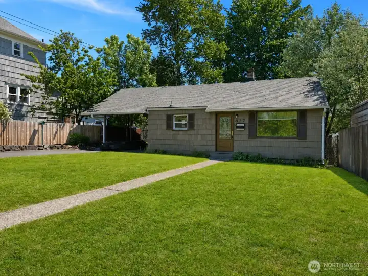Welcome home - move-in ready with fresh exterior paint and a new roof and gutters—great curb appeal! Ample off-street parking provides room for multiple vehicles.