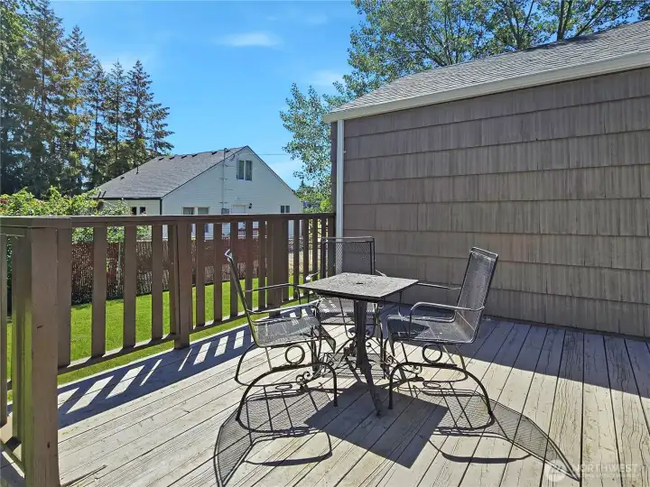 The back deck is easily reached from the kitchen via the laundry/mud room—great for outdoor dining and enjoying the outdoors!