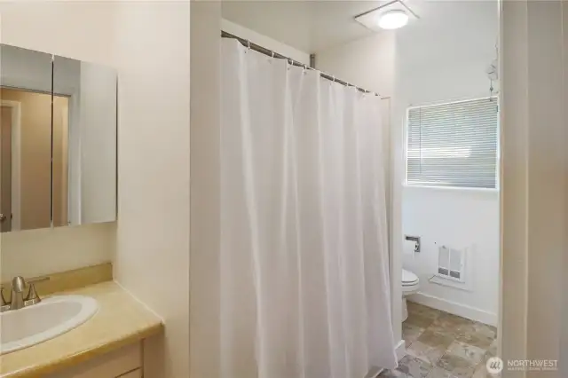 Functional full bath with classic style, conveniently located near all bedrooms.
