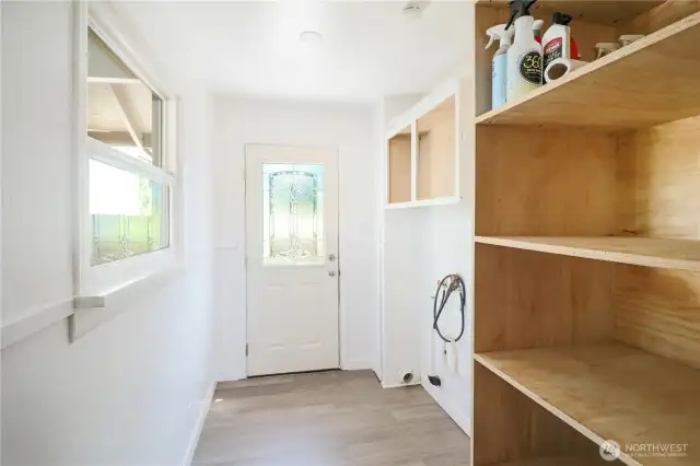 Laundry/mud room with backyard access—perfect for keeping everyday life organized.
