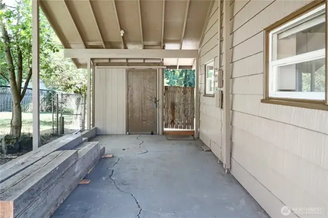 Attached carport offers covered parking and easy access to the home and a bonus storage shed for tools, hobbies, or seasonal items.