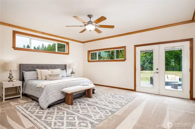 Primary suite is extra large with French doors to the patio. Sip morning coffee and watch wildlife. What a lovely way to start the day!
