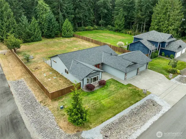 Aerial view of the home looking SW. Note the dead-end road to the left that provides access to the backyard. It's great for moving in/out, R/V access, and access for a potential DADU (subject to HOA approval).