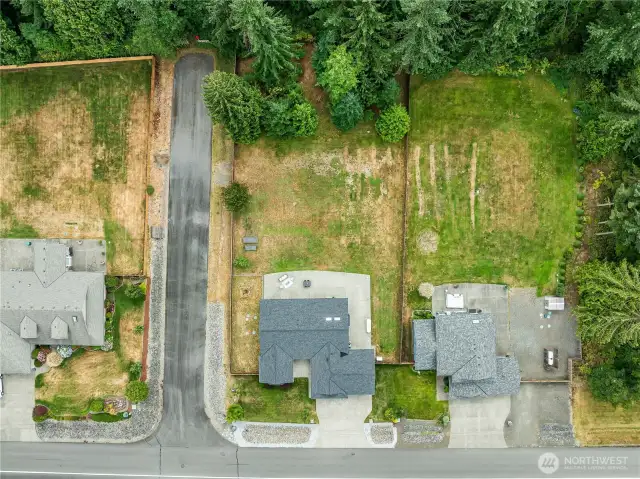 Aerial directly overhead. The street running vertically is 113th Ave NE. It is a dead end street that provides additional privacy and easy access to the backyard through a wide gate on the upper left. This is a highly desirable corner lot and one of the reasons the sellers bought this particular property.