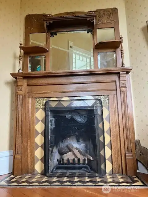 Decorative fireplace in the den/office.