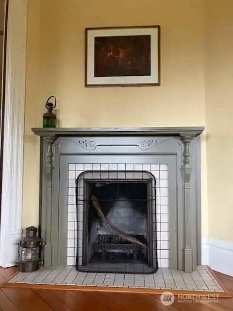 Living room anchored by a decorative fireplace.