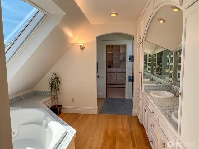 Roomy primary bath with double sinks, jetted tub, toilet, bidet, shower and walk-in closet.