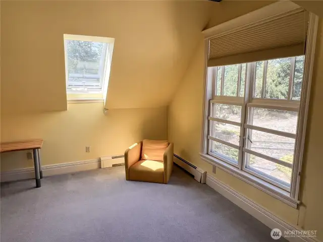 Second bedroom with skylight, double window and walk-in closet.