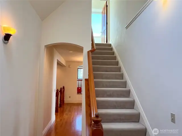 Inviting archway and stairs to the 3rd floor room.