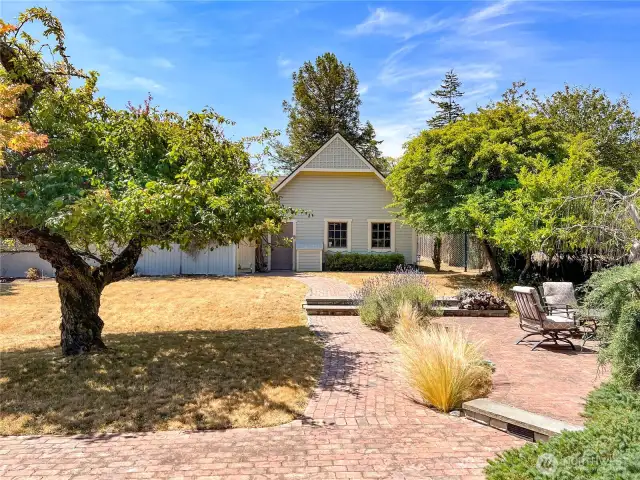 Paved walkway to the patio and garage.