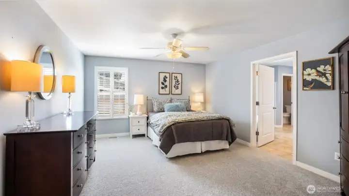 Step into this spacious primary bedroom designed for comfort & Relaxation. The luxurious ensuite bathroom features a soaking tub, separate shower, double sink vanity for added convenience. Enjoy plantation shutters that provide both privacy & natural light. The huge walk-in closet offers ample space for all your wardrobe needs.